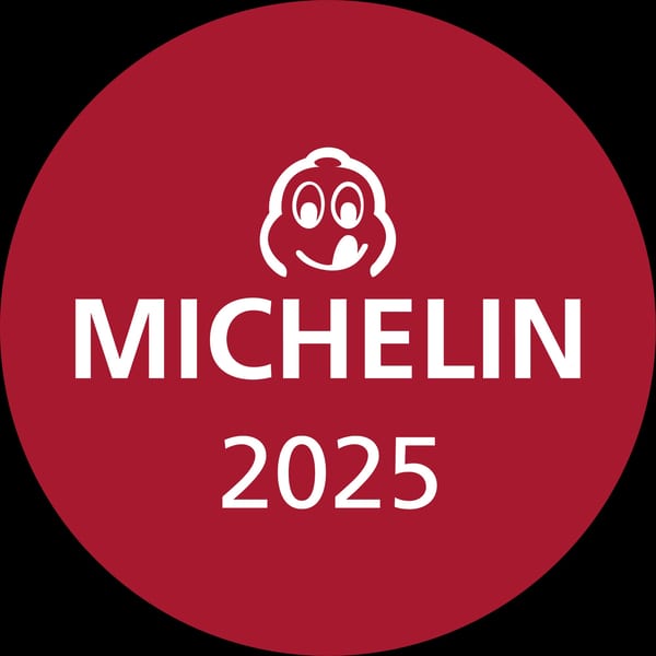 Red circular Michelin Guide 2025 logo with the iconic white Bibendum character.